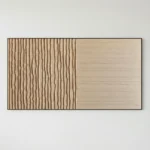Minimalist hand-painted canvas with textured vertical striations in warm cream and natural wood tones, contemporary interior