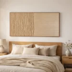 Minimalist hand-painted canvas with linear relief texture and natural wood tones, modern bedroom setting