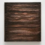 Textured abstract hand-painted canvas with layered crocodile-embossed patterns in deep bronze and terracotta tones