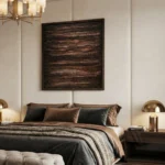 Textured abstract hand-painted canvas in charcoal and burnt sienna with layered horizontal marks, modern bedroom