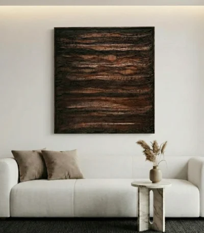 Textured abstract hand-painted canvas in layered earth tones and charcoal, contemporary living space