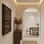 Textured abstract hand-painted canvas in warm terracotta and bronze tones, contemporary entryway