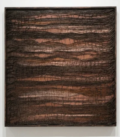 Textured abstract hand-painted canvas with layered crocodile-embossed patterns in deep bronze and terracotta tones