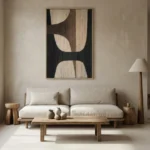 Minimalist abstract hand-painted canvas with organic curved forms in cream and charcoal, contemporary living space