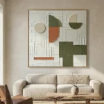Textured abstract hand-painted canvas with geometric shapes in sage green, terracotta, and cream tones, contemporary living space