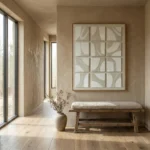 Textured abstract hand-painted canvas in cream and ivory organic curves with layered relief detail, contemporary hallway setting