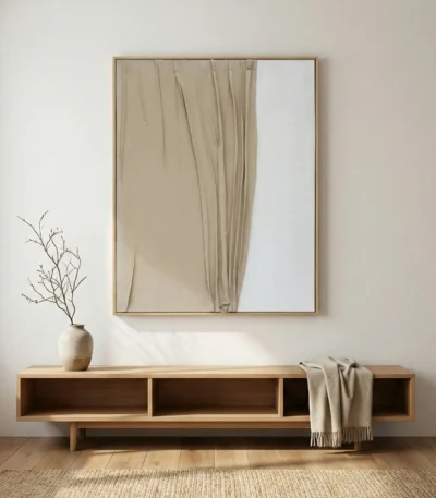Minimalist hand-painted canvas with flowing draped fabric and negative space in soft beige and cream tones, contemporary interior