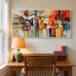 Gestural abstract expressionist hand-painted canvas in vibrant reds, oranges, yellows and teals with dynamic layered brushstrokes, styled in contemporary study space