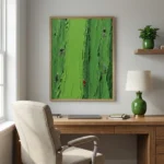 Contemporary hand-painted canvas depicting miniature figures climbing textured green mountain landscape, modern office setting