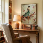 Figurative hand-painted canvas of woman in floral dress with cascading flowers, soft cream and coral palette, styled study