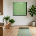 Minimalist landscape hand-painted canvas depicting two swimmers in serene green water, yoga studio setting