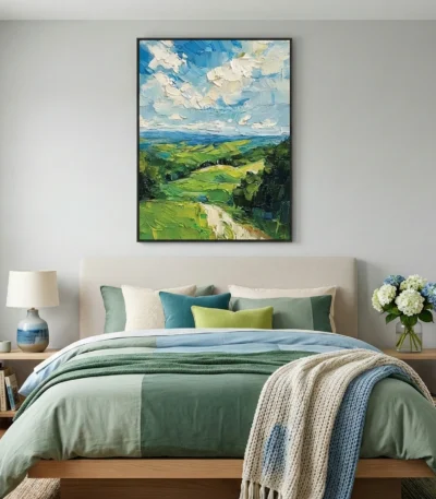 Impressionist landscape hand-painted canvas depicting rolling green hills, distant ocean, and dramatic sky in blue and cream tones, modern bedroom