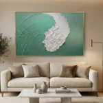 Textured abstract hand-painted canvas with white gestural brushstrokes on soft sage green, contemporary living space