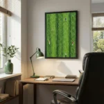 Contemporary landscape hand-painted canvas depicting vast green fields with distant figures in muted tones, styled in modern workspace