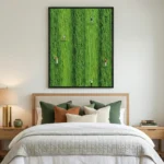 Aerial hand-painted canvas depicting scattered figures across vibrant emerald green landscape in contemporary bedroom