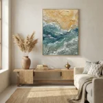 Textured abstract hand-painted canvas in layered ocean blues, greens, and sandy tones, contemporary living space