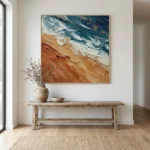 Textured abstract seascape hand-painted canvas in layered teal, cream, and terracotta brushstrokes, contemporary entryway