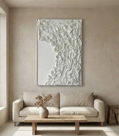 Textured abstract hand-painted canvas in layered white and cream tones with gestural brushwork, contemporary living space