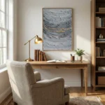 Textured abstract hand-painted canvas in layered grey and gold brushstrokes, styled in a contemporary study