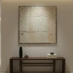 Textured minimalist hand-painted canvas in cream and off-white with subtle layered brushwork, contemporary entryway