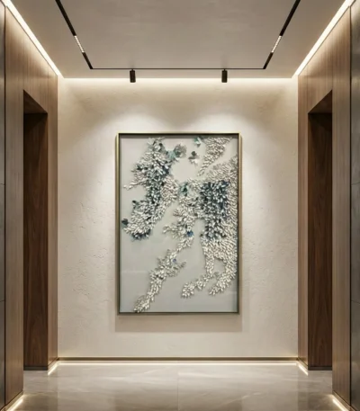 Textured hand-painted canvas depicting cascading botanical foliage in cream and soft green tones, contemporary hallway