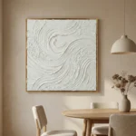 Textured abstract hand-painted canvas with swirling gestural brushstrokes in white and cream, contemporary dining space