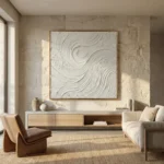 Textured abstract hand-painted canvas with flowing white gestural brushstrokes in cream and ivory tones, contemporary living space