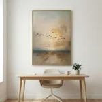 Textured impressionist hand-painted canvas depicting migratory birds over misty wetlands in warm golden and soft grey tones, contemporary workspace