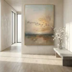 Impressionist landscape hand-painted canvas depicting sailing boats and migrating birds in golden sunset tones, contemporary entryway