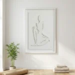 Minimalist hand-painted canvas depicting an abstract seated figure in gestural charcoal strokes, monochrome palette, modern interior setting