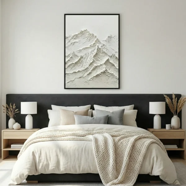 Textured monochrome hand-painted canvas depicting layered snow-capped mountain peaks in subtle relief, contemporary bedroom