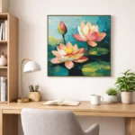 Impressionist hand-painted canvas depicting vibrant lotus flowers in coral, pink, and cream with turquoise water and green lily pads, contemporary workspace