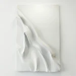 Textured abstract hand-painted canvas in white and cream with dynamic sculptural folds and gestural sweeps, contemporary living space