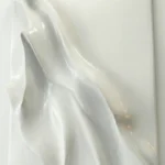 Gestural abstract hand-painted canvas in flowing ivory and cream tones with layered translucent brushstrokes, contemporary interior