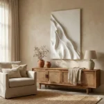 Textured abstract hand-painted canvas in flowing white cream tones with sculptural relief, contemporary living space