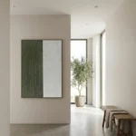 Minimalist hand-painted canvas in sage green and cream with textured vertical brushstrokes, contemporary entryway