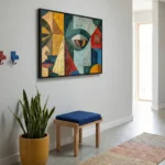 Cubist hand-painted canvas featuring abstracted faces in mustard, teal, red and blue geometric segments, modern entryway