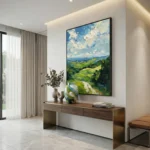 Impressionist landscape hand-painted canvas depicting rolling green hills, cloudy sky in blues and whites, contemporary entryway