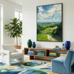 Impressionist landscape hand-painted canvas depicting rolling green hills beneath dramatic clouded sky in vibrant blues and yellows, contemporary living space
