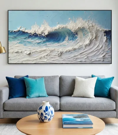 Textured contemporary seascape painting with dynamic ocean waves in layered blues and creams, hand-finished canvas in modern living space