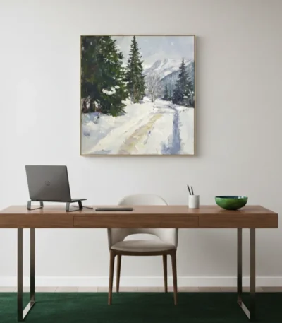 Impressionist landscape hand-painted canvas depicting snowy mountain road lined with evergreen trees in cool whites and greens, contemporary workspace
