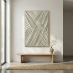 Textured abstract hand-painted canvas with interlocking diagonal striations in soft grays and cream, contemporary entryway