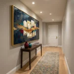 Gestural abstract hand-painted canvas with golden brushstrokes, deep blues and burgundy accents, modern hallway setting