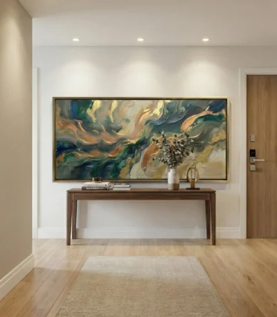 Layered abstract hand-painted canvas in swirling teal, gold, and cream tones, modern entryway