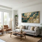 Layered abstract hand-painted canvas in swirling teal, gold, and cream tones, contemporary living space
