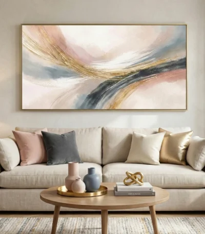 Layered abstract hand-painted canvas with sweeping gestural brushstrokes in gold, charcoal, and blush tones, contemporary living space