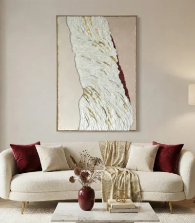 Textured abstract hand-painted canvas with cream and gold gestural brushstrokes accented by deep burgundy, contemporary living space