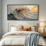 Textured contemporary seascape painting with dramatic wave and golden sunset in cream, bronze, and grey tones, modern bedroom