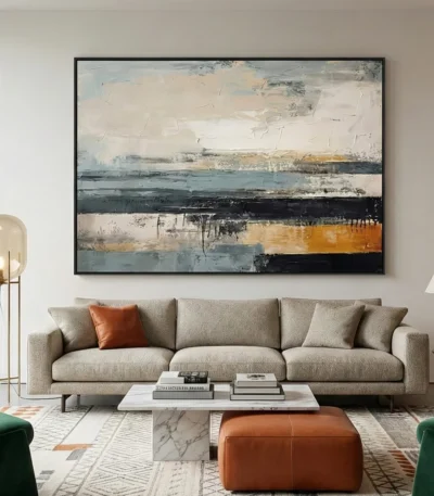 Layered abstract hand-painted canvas in cream, charcoal, and ochre horizontal strokes, contemporary living space