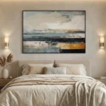 Layered abstract hand-painted canvas in horizon stripes of cream, slate blue, black and ochre with gestural marks, modern bedroom setting